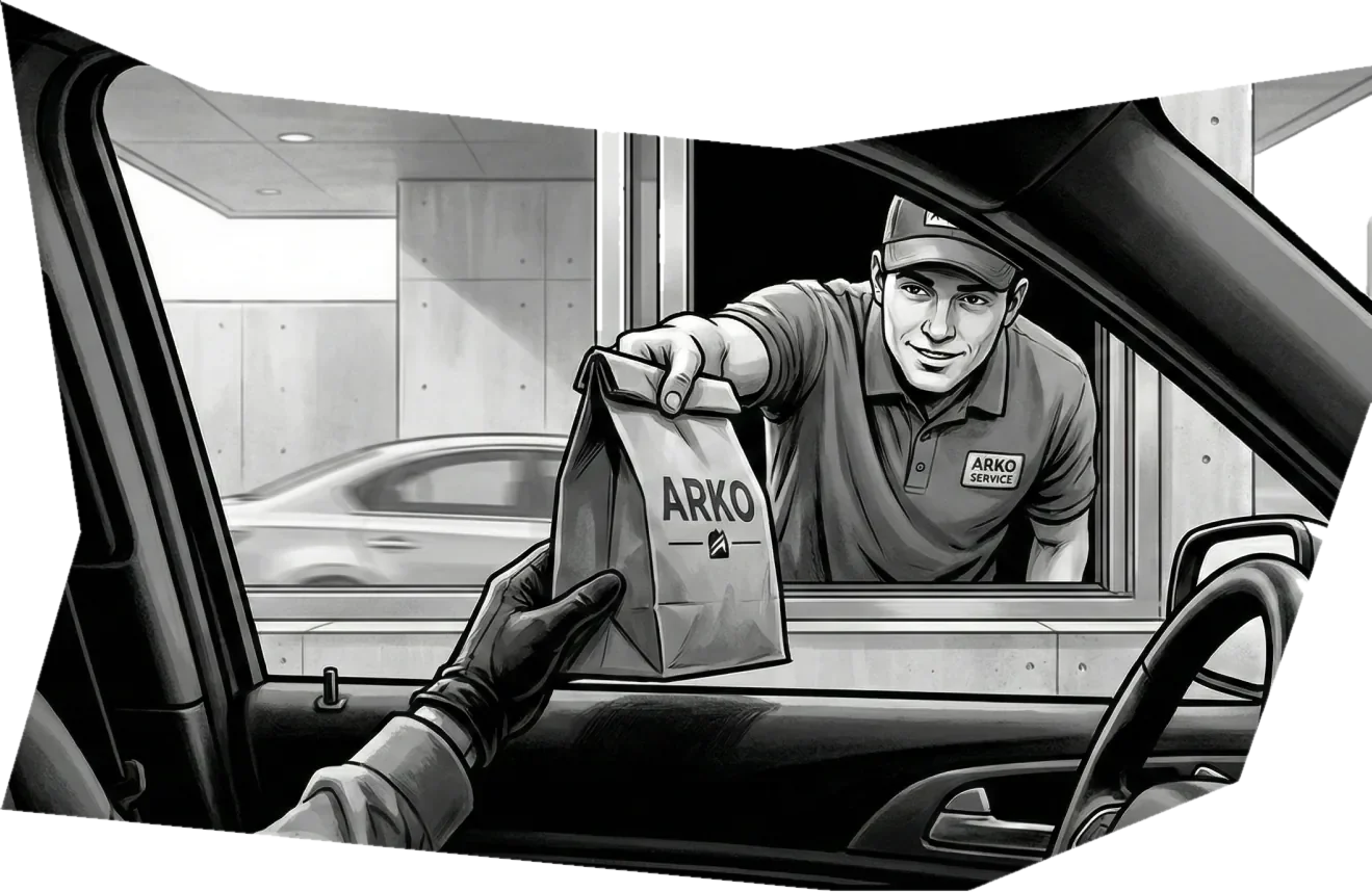 Comic panel: a staff member hands a bag through the car window